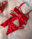 Luxurious red satin bra set with bow, offering elegance and comfort for all seasons, part of homewear collection.